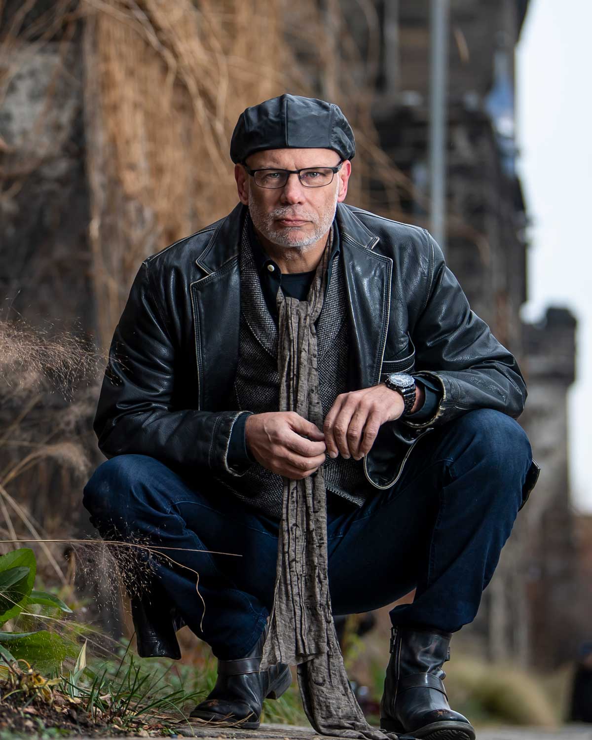 Dr. Gregory McDonald is shown in front of a stone wall.