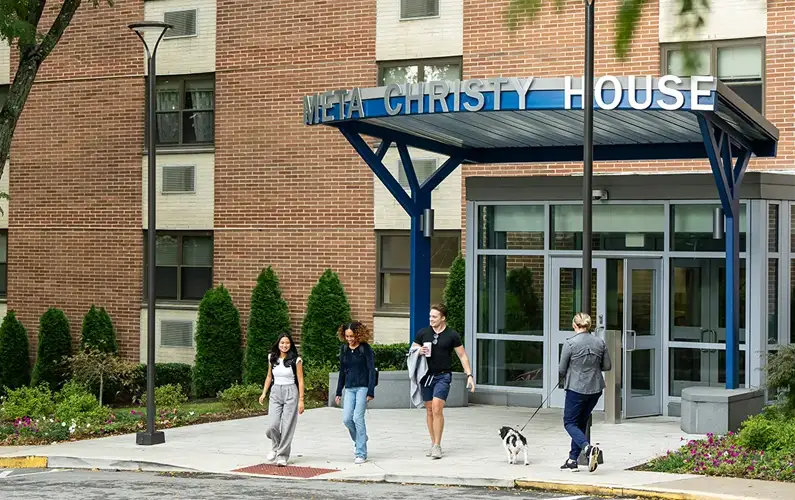 Students exiting the front entrance of Meta Christy House