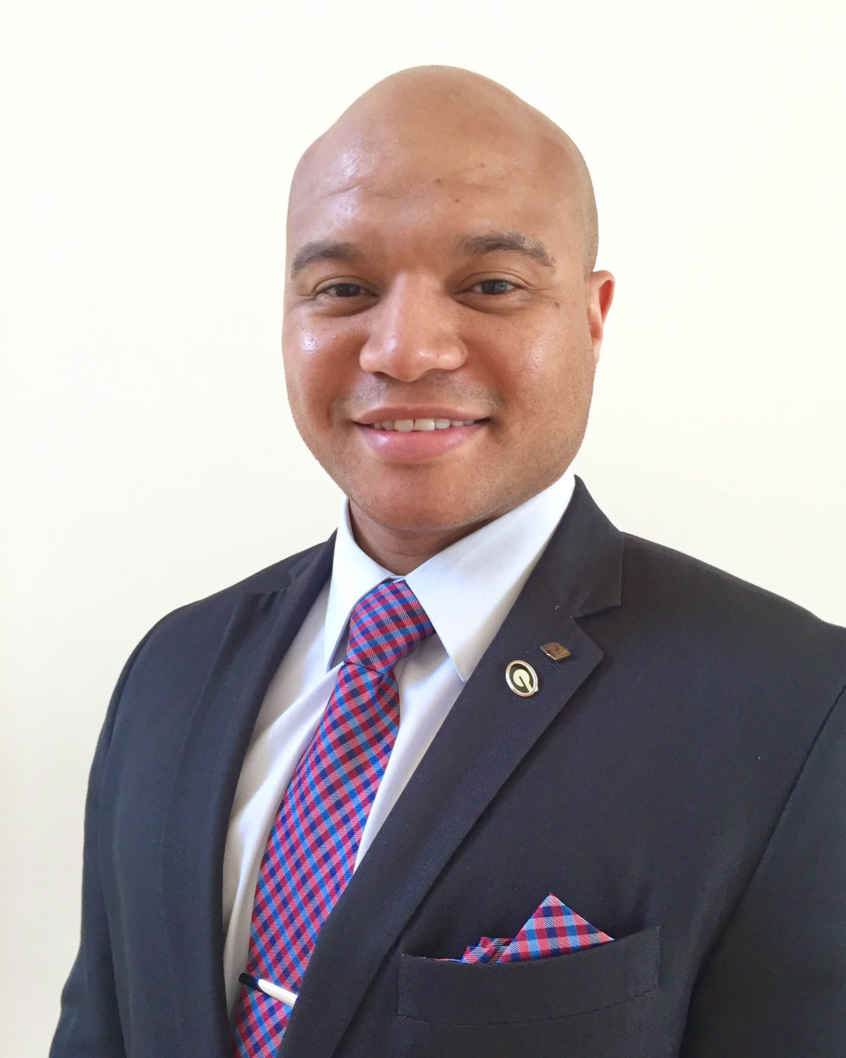 Professional headshot photograph Abdul Walters wearing a suit