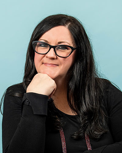 Headshot photograph of Julie A. Caffrey, DO '08