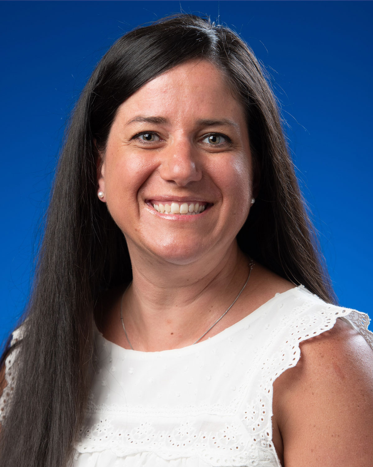 Headshot photograph of PCOM Georgia physical therapy faculty Dr. Alaina Bell wearing a scarf outside.