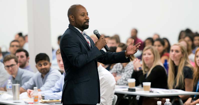 Craig Brown, JD, MBA, GA-PCOM Director of Admissions, addresses prospective students during an open house event.