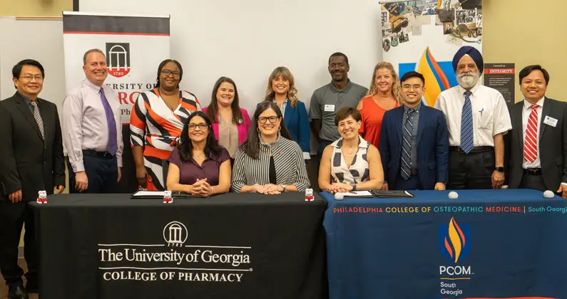 Representatives from the UGA College of Pharmacy, PCOM Georgia, and PCOM South Georgia pose for group photo