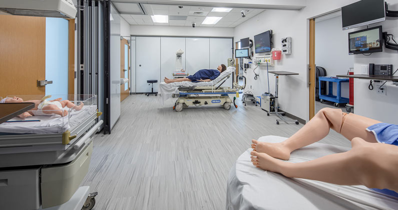 Mother and baby mannequins within the maternity area at the PCOM South Georgia Simulation Center