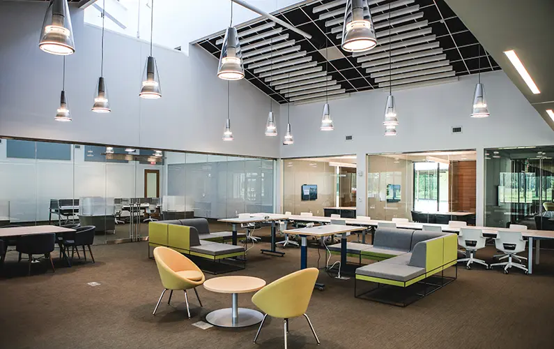 Open concept space with computer stations, study pods, comfortable seating and several group study rooms.